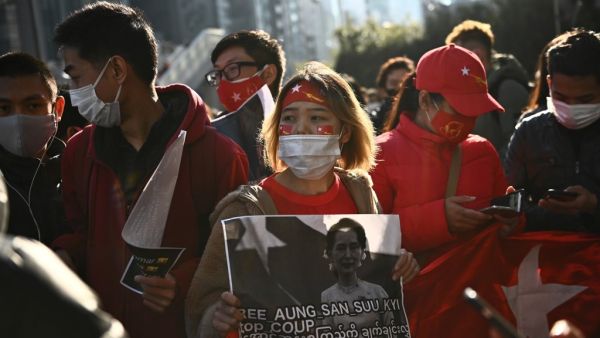 A group of Myanmar activists protests outside outside the United Nations university building in Tokyo on February 1, 2021 following a military coup in the country by a general after arresting civilian leader Aung San Suu Kyi and other senior officials. Philip FONG / AFP
