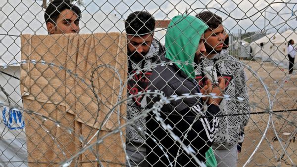 Asylum seekers staying in the Pournara temporary accommodation centre protest over delays in their application process and what they described as the inhumane living conditions in the camp, in Kokkinotrimithia, some 20 kilometres outside the Cypriot capital Nicosia, on February 1, 2021. Due to the closure of other migration routes to Europe, asylum applications have increased sixfold over the last five years in Cyprus -- a country of fewer than one million inhabitants -- from 2,265 in 2015 to 13,650 in 2019