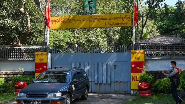 A car leaves the residence of Aung San Suu Kyi in Yangon on February 2, 2021, as Myanmar's generals appeared in firm control a day after a surgical coup that saw democracy heroine Suu Kyi detained. STR / AFP