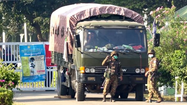 This screengrab taken from AFPTV video footage shows soldiers at the entrance to a guesthouse, where members of parliament reside at, in the country's capital Naypyidaw on February 2, 2021, as Myanmar's generals appeared in firm control a day after a surgical coup that saw democracy heroine Aung San Suu Kyi detained. STR / AFPTV / AFP