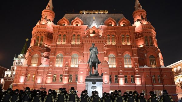 Law enforcement officers stand guard in front of a monument to Soviet Marshal Georgy Zhukov outside Red Square in Moscow on February 2, 2021. Kirill KUDRYAVTSEV / AFP