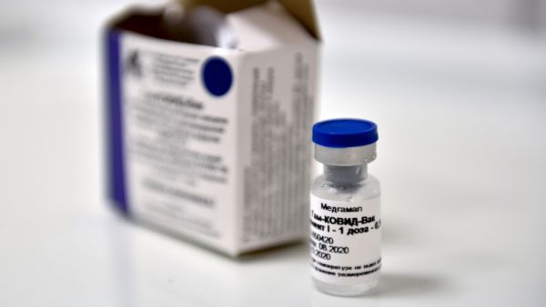 In this file photo taken on September 10, 2020 a vial with Russia's new coronavirus vaccine is seen prior to a vaccination of a volunteer in a post-registration trial, Moscow. Mexico authorized Russia's Sputnik V virus vaccine, the government informed on February 2, 2021. Natalia KOLESNIKOVA / AFP
