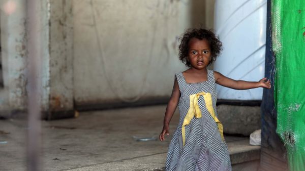A girl looks on inside a school building for displaced Yemenis who fled fighting between Huthi rebels and the Saudi-backed government forces, in the town of al-Turba in Taez governorate on February 4, 2021. AHMAD AL-BASHA / AFP
