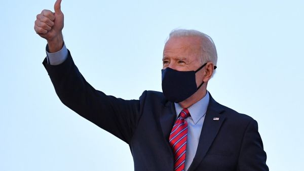 US President Joe Biden gives a thumbs up as he boards Air Force One before departing from Andrews Air Force Base in Maryland on February 5, 2021. Biden is traveling to Wilmington, Delaware where he is scheduled to spend the weekend. MANDEL NGAN / AFP