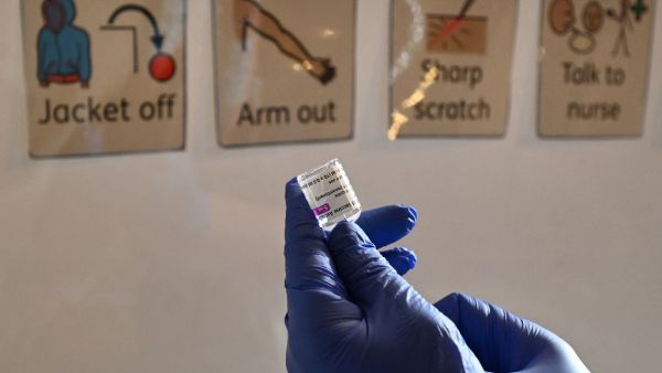 A health worker prepares a dose of the AstraZeneca/Oxford Covid-19 vaccine at a temporary vaccine centre set up at City Hall in Hull, northeast England on February 10, 2021. Paul ELLIS / AFP