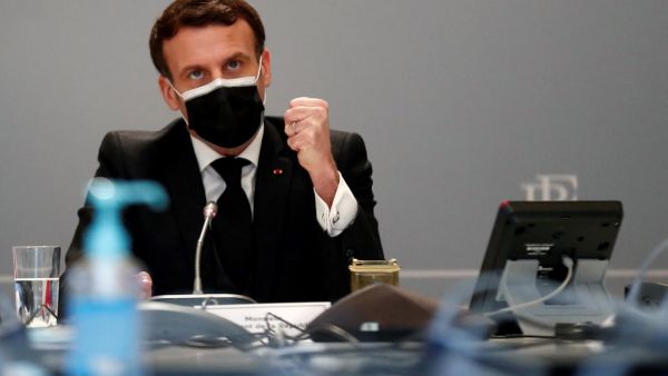 French President Emmanuel Macron delivrs initial remarks during the Act-A visionconference meeting at the Elysee Palace in Paris, on February 12, 2021. The Act-A launched by the World Health Organization is the initiative to coordinate a global response to the Covid-19 pandemic. Ian LANGSDON / POOL / AFP