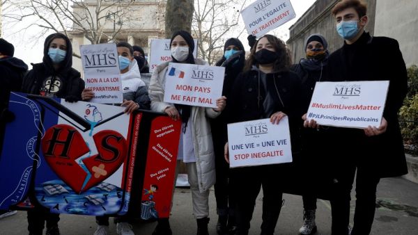 Protesters demonstrate against a bill dubbed as "anti-separatism", in Paris on February 14, 2021. French lawmakers a few weeks ago began debating a controversial bill against what the interior minister described as the "disease" of Islamist extremism eating away at the country's unity. President Emmanuel Macron has pushed for the legislation, which would tighten rules on issues ranging from religious-based education to polygamy, since a spate of attacks blamed on extremists late last year. GEOFFROY VAN DER 