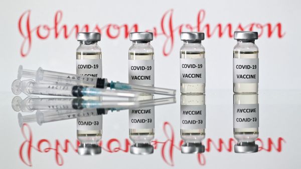 A file photo taken on November 17, 2020 shows vials with Covid-19 Vaccine stickers attached and syringes with the logo of US pharmaceutical company Johnson & Johnson in London. The US Food and Drug Administration (FDA) on February 27, 2021 issued emergency use authorization for the Johnson & Johnson Covid-19 vaccine. JUSTIN TALLIS / AFP Johnson & Johnson prepares for entry into the US market