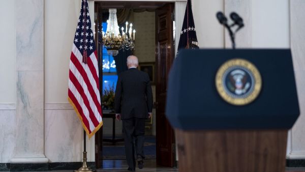 U.S. President Joe Biden leaves after delivering remarks on the more than 500,000 lives lost to COVID-19, in the Cross Hall of the White House February 22, 2021 in Washington, DC. Also on hand for the ceremony were first lady Jill Biden, Vice President Kamala Harris and husband Doug Emhoff. Doug Mills-Pool/Getty Images/AFP