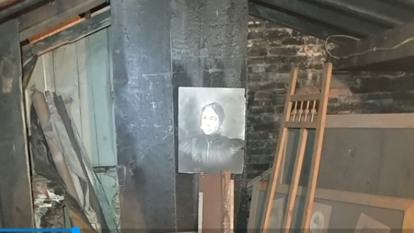 A New York state attorney who bought a building to expand his practice discovered a hidden attic that contained photographs and photography-related items. (Video Screenshot)