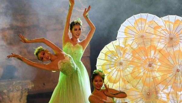 Chinese dancers perform during the opening of the 54th session of the International Carthage Festival at the Roman theatre of Carthage on August 11, 2018 in Tunis. (AFP)