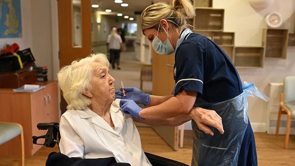 A UK care home resident receives a dose of the AstraZeneca vaccine last month, with Britain among the world leaders in the vaccine race so far. (AFP)