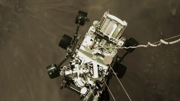 NASA shared an exciting image shot by the sky crane that shows Perseverance, nicknamed Perky, slung beneath and attached to mechanical bridals – moments before making landfall. NASA believes this image will become an iconic picture of spaceflight history. (NASA)