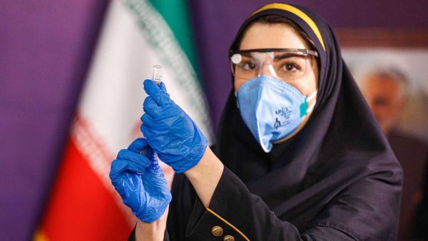 A health worker prepares an injection during the first trial phase of a locally made Iranian vaccine against COVID-19 in Iran's capital Tehran on Dec. 29, 2020. Photo by AFP via Getty Images  