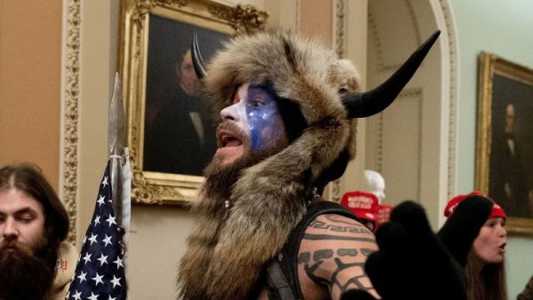 The Justice Department announced Saturday that it had charged the man known as the "QAnon shaman," Jacob Anthony Chansley, in connection with the Capitol break-in on Wednesday. Saul Loeb/AFP via Getty Images