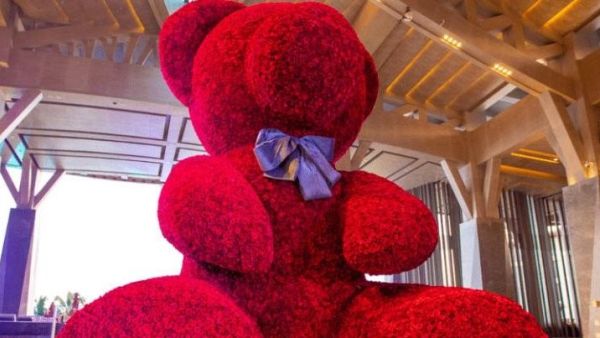 A 20-foot-2-inch tall bear made from 18,000 roses attached to a metal frame broke a Guinness World Record. (Photo courtesy of Guinness World Records)