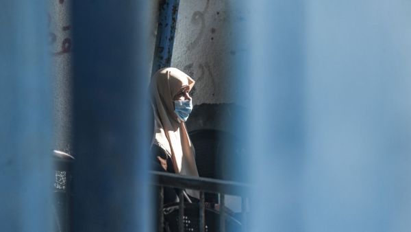 An elderly refugee awaits for UNRWA aid  