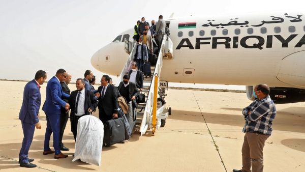 Delegates arrive at the airport of Libya's north-central coastal city of Sirte 