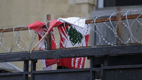 The Lebanese flag tangled in barbed wire 