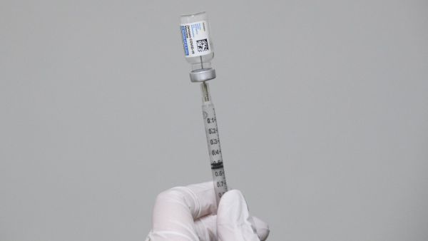 A syringe is filled with a dose of the Johnson & Johnson Janssen Covid-19 vaccine at a vaccination site organized by the United Farm Workers (UFW), Kern Medical, the Kern County Latino Covid-19 Task Force inside Reuther Hall at Forty Acres on March 13, 2021 in Delano, California. Central Valley farm workers were administered the vaccines free of charge, regardless of insurance or immigration status. Patrick T. FALLON / AFP A syringe with a dose of the Johnson & Johnson Janssen Covid-19 vaccine at a vaccination