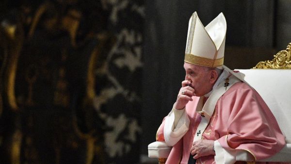Pope Francis listens to Philippine Cardinal Luis Antonio Tagle