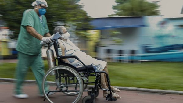 A COVID-19 patient arrives to a hospital set up in a sports gym, in Santo Andre, Sao Paulo state, Brazil, on March 26, 2021. Brazil set a new daily Covid-19 death toll record of 3,650 on Friday, the health ministry said, as the pandemic spins out of control in Latin America's largest economy. Miguel SCHINCARIOL / AFP Brazil's Coronavirus deaths shoot up