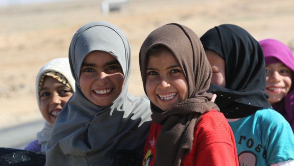 Syrian kids say cheese at Jordan's Zaatari Refugee Camp