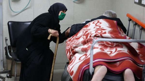 Syrians suspected of being infected with Covid-19 receive treatment at Mouwasat Hospital in Damascus