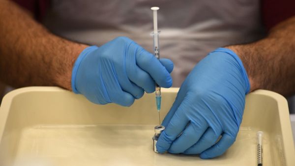 Health worker prepares a dose of the BioNTech/Pfizer covid-19 vaccine 
