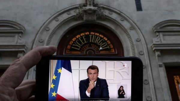Macron via a smartphone 