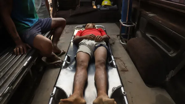 The body of Zaw Ko Latt, a protester shot dead is laid out on a stretcher in a vehicle in Mandalay 