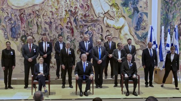 Israeli Prime Minister Benjamin Netanyahu (C) along with party leaders pose for a group photo at the Chagall Hall of Knesset following the swearing-in ceremony of Israel's 24th government