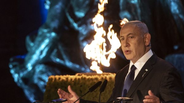 Israeli Prime Minister Benjamin Netanyahu delivers a speech at the Holocaust Martyrs' and Heroes Remembrance Day ceremony in memory of the six million Jewish men, women and children murdered by the Nazis and their collaborators, at the Yad Vashem memorial in Jerusalem on April 7, 2021. Heidi levine / POOL / AFP  Benjamin Netanyahu delivers a speech at the Holocaust Martyrs' and Heroes Remembrance Day