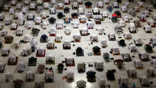 Muslim worshippers perform the evening Tarawih prayer during the fasting month of Ramadan around the Kaaba in the Grand Mosque 
