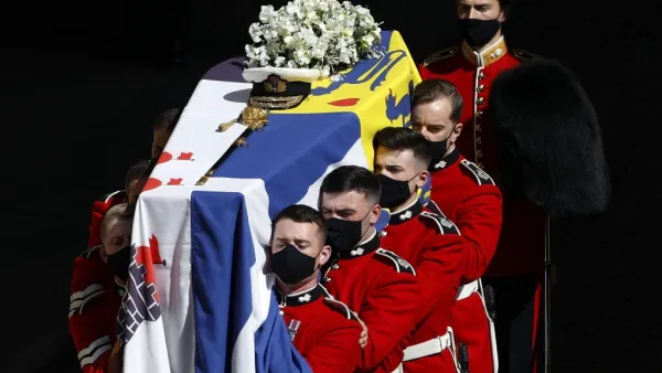 The coffin of Britain's Prince Philip, Duke of Edinburgh is laid onto a modified Land Rover Defender 