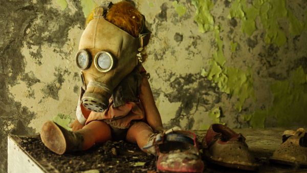A doll in a gas mask
