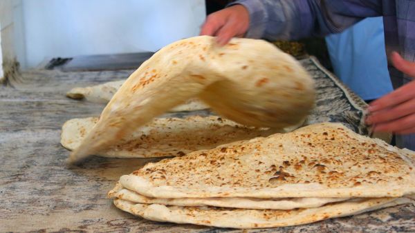 arab baker making arabic bread