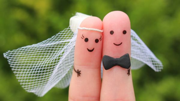 Fingers art of happy couple to get married