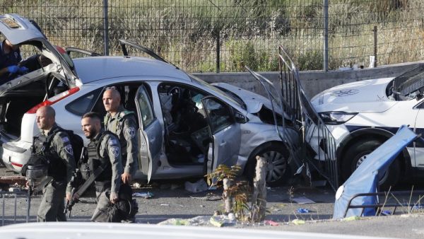 Israeli security forces inspect on May 16, 2021 the scene of a car-ramming attack which wounded several people, including four police officers, in the flashpoint Sheikh Jarrah neighbourhood of Israeli-annexed east Jerusalem. After the "vehicle-ramming attack" in the district, the scene of weeks of clashes between Palestinians and Israeli security forces, the assailant was "shot by officers", police spokesman Micky Rosenfeld said without giving details on the attacker's condition. 