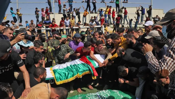 Palestinians carry the bodies of members of the Ezz-Al Din Al-Qassam Brigades, the armed wing of the Hamas movement, who died in Israeli bombardment of a tunnel, during a funeral procession in Khan Younis, in the southern Gaza Strip