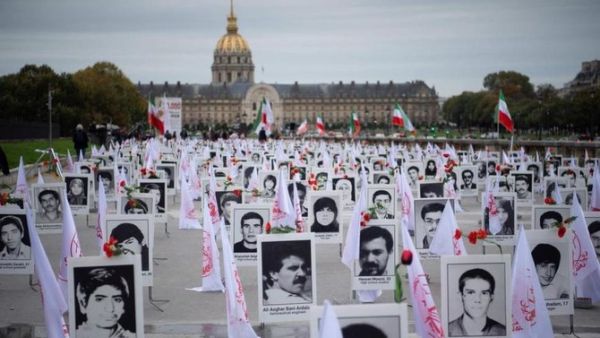 The 1988 executions of thousands of Iranian political prisoners were commemorated by representatives of the People's Mujahedin of Iran in France in 2019. (AFP/File Photo) Protect their graves: Families of those murdered appeal to the UN