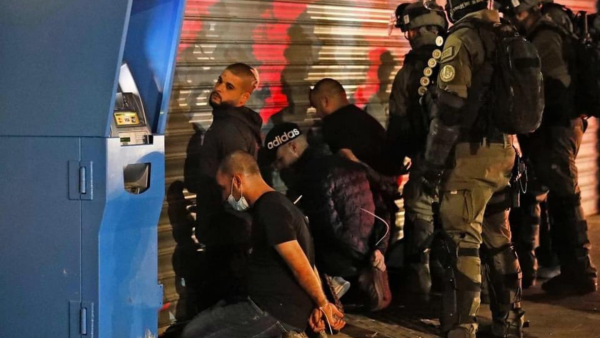 Palestinian Israelis had take to the streets during Israel's military operation against Gaza triggering clashes. (Twitter: @MMas2ool) Israeli police arresting Palestinians