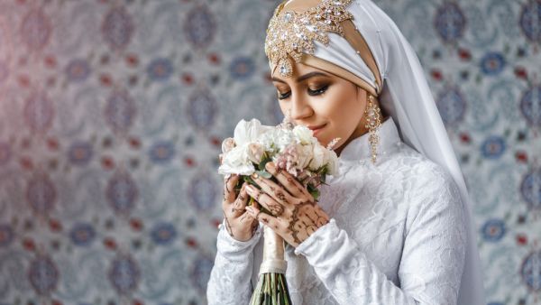 Muslim bride with jewelery in a headscarf hijab