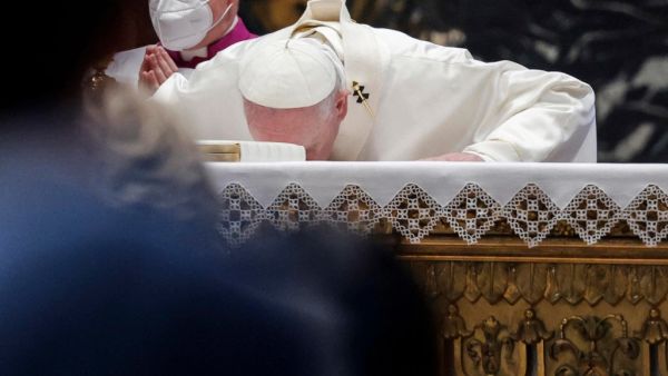 Pope Francis kisses the altar as he leads a Holy Mass on the Solemnity of the Most Holy Body and Blood of Christ in Saint Peter's Basilica at the Vatican City