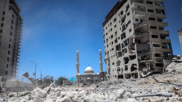 Workers clear the remaining rubble of the Hanadi Tower, a building that was levelled in an Israeli attack during the 11-day conflict between the Jewish state and the Palestinian Hamas movement in May this year, in Beit Lahia in the northern Gaza Strip, on July 8, 2021. MOHAMMED ABED / AFP UNRWA says Israeli war on Gaza caused a large-scale destruction as 1,200 houses had been assessed.