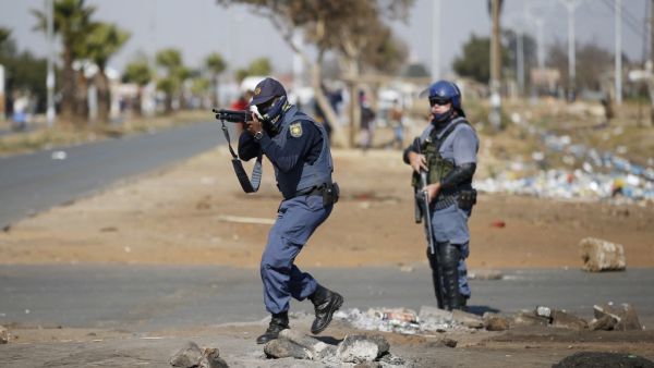 Several shops are damaged and cars burnt in Johannesburg, following a night of violence. Police are on the scene trying to control further protests. It is unclear if this is linked to sporadic protests following the incarceration of former president Jacob Zuma. Phill Magakoe / AFP 7 killed amid violent protests over jailing of ex-South African president Jacob Zuma