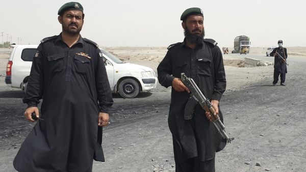 Frontier constabulary personnel stand guard in the border town of Chaman on July 16, 2021, following clashes between Afghan forces and Taliban fighters in Spin Boldak to retake the key border crossing with Pakistan
