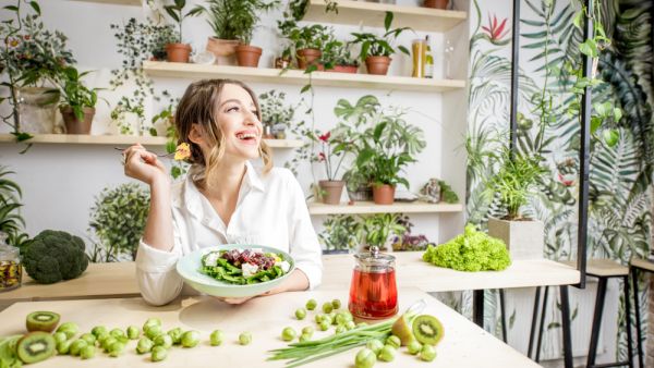 Young woman eating healthy food 