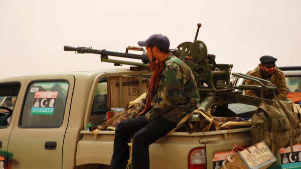 Libyan rebels travel to a battle line where they will fight 