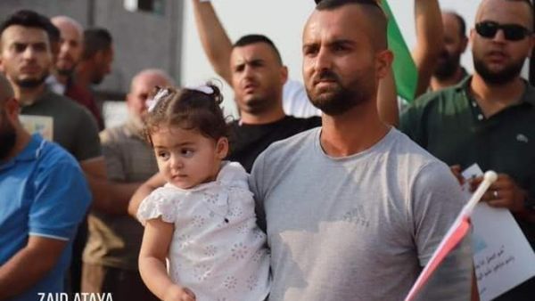 The daughter of Palestinian pregnant detainee Anhar al-Deek, Julia  in protest against her mom 's detention